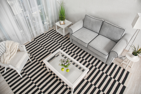 Modern living room design with big striped carpetの写真素材