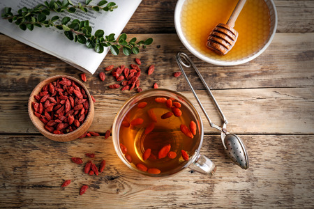 Composition with goji tea on wooden tableの写真素材