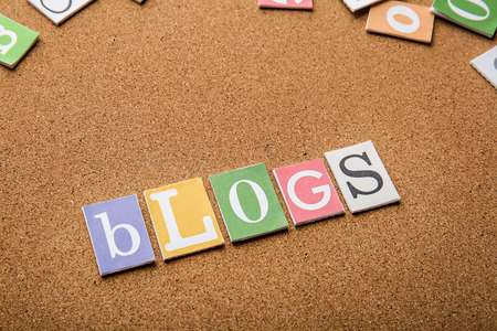 Word BLOGS on brown background