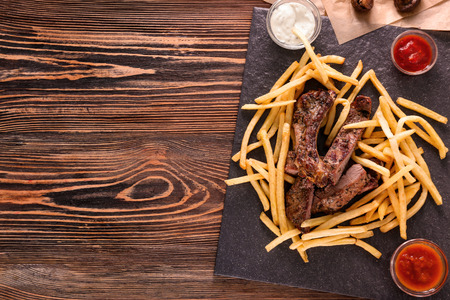 Delicious grilled steak frites on slate plate