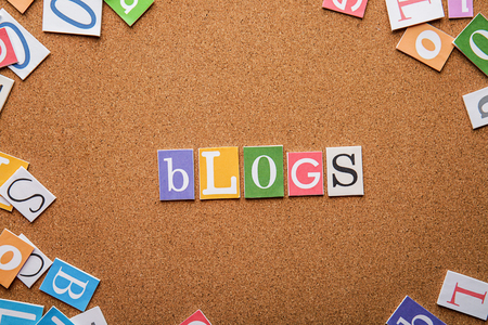 Word BLOGS on brown background
