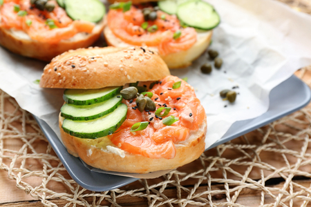 Tasty bagel with salmon on plate, closeupの写真素材