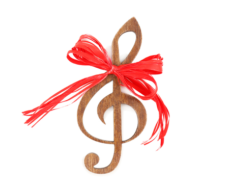 Christmas music concept. Decorative clef with bow, isolated on white backgroundの写真素材