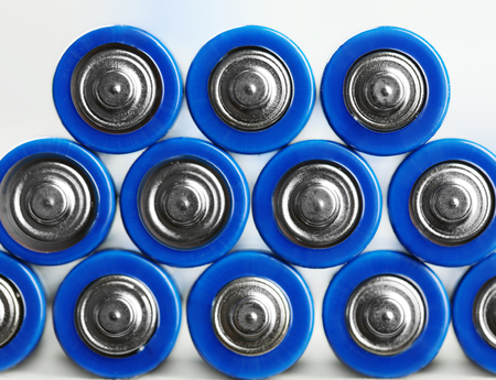 Many used batteries on white backgroundの写真素材