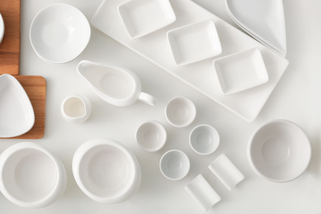 Set of ceramic tableware in kitchen drawerの写真素材
