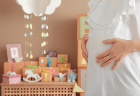 Pregnant woman at baby shower party indoorsの写真素材