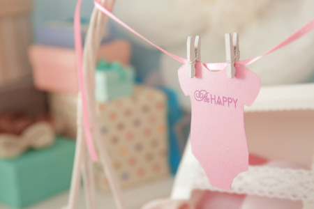 Adorable greeting card for baby shower on blurred backgroundの写真素材