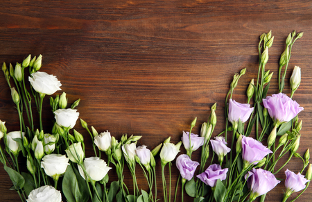 Beautiful flowers on wooden backgroundの写真素材