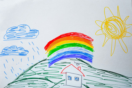 Child's drawing of house and rainbowの写真素材
