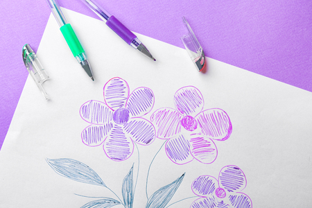 Child's drawing of beautiful flowers on color background, closeupの写真素材
