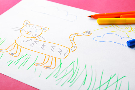 Child's drawing of cute cat on color background, closeupの写真素材