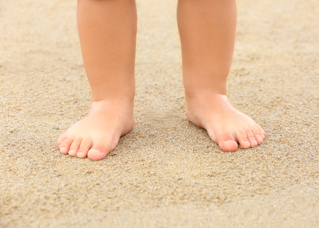 Little boy standing on beachの写真素材