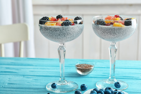 Glasses with delicious chia seed pudding on tableの写真素材