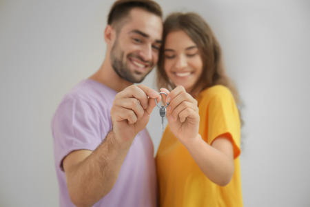 Young couple with key at new homeの写真素材