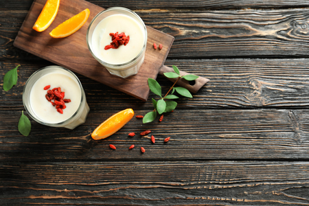 Smoothie with goji berries in glasses on tableの写真素材