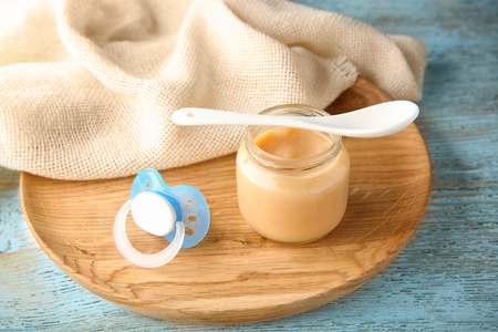 Jar of tasty baby food on tableの写真素材