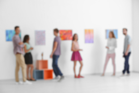 Blurred view of crowded art galleryの写真素材