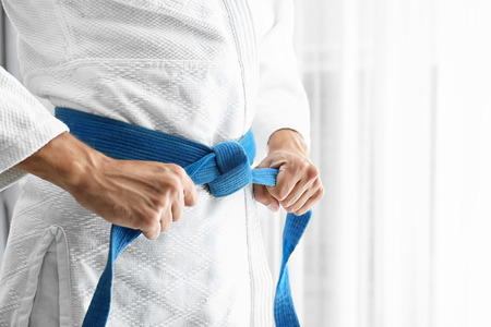 Man in karategi indoors, closeupの写真素材