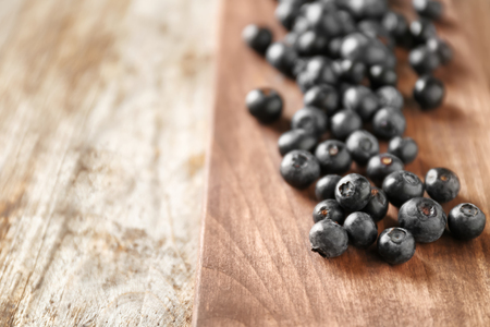 Fresh acai berries on wooden table, closeupの写真素材