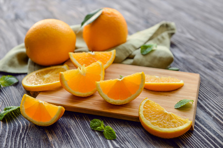 Fresh sliced orange on wooden tableの写真素材