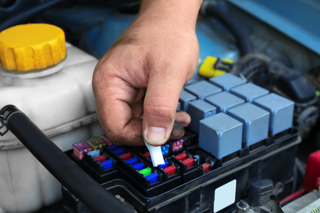 Auto mechanic repairing car, closeupの写真素材