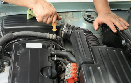Auto mechanic repairing car, closeup
