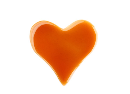 Delicious caramel sauce on white backgroundの写真素材