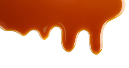 Delicious caramel sauce on white backgroundの写真素材