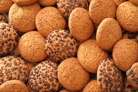 Tasty oatmeal cookies as background