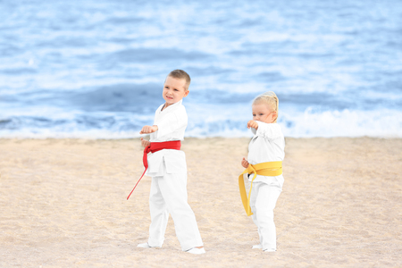 Little children practicing karate outdoorsの写真素材