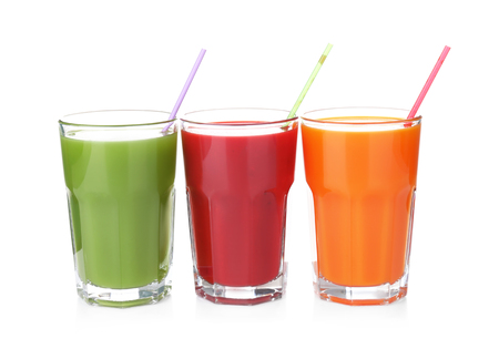 Glasses with various fresh juices on white backgroundの写真素材