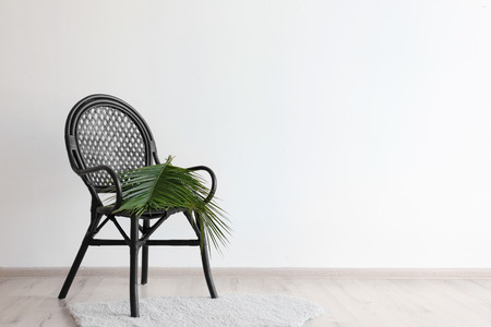 Palm leaves on chair indoorsの写真素材
