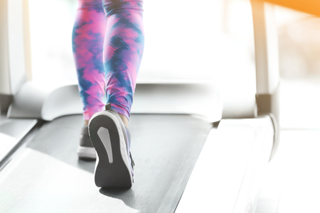 Beautiful young woman training in gymの写真素材