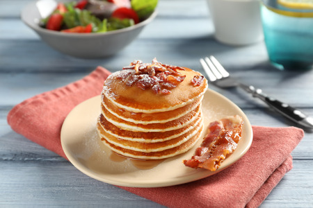 Tasty breakfast with pancakes and bacon on tableの写真素材