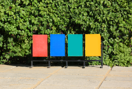 Recycling bins for different types of garbage outdoors