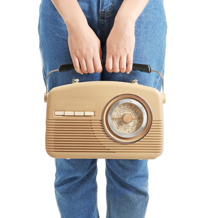 Woman holding radio on white backgroundの写真素材