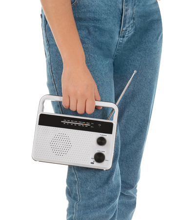 Woman holding radio on white backgroundの写真素材