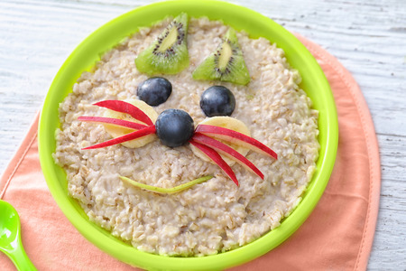 Creative oatmeal for children on tableの写真素材