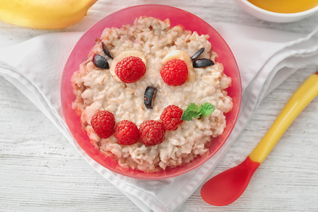 Creative oatmeal for children on tableの写真素材
