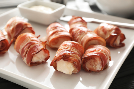 Plate with bacon wrapped chicken nuggets, closeupの写真素材