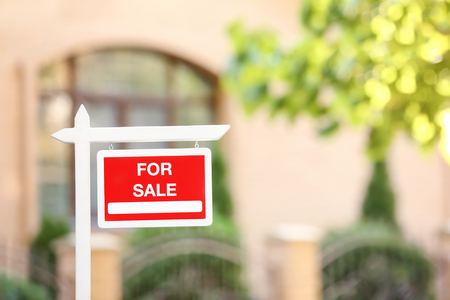 "For sale" sign near houseの写真素材