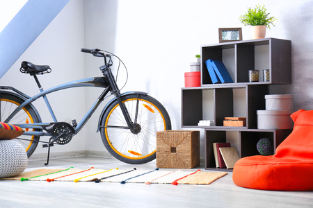 Modern room interior with bicycle and shelving unitの写真素材