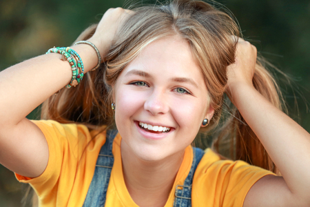 Portrait of funny teenager girl outdoorsの写真素材