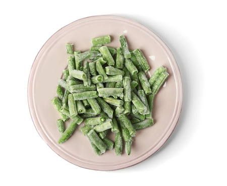 Plate with frozen green beans on white backgroundの写真素材