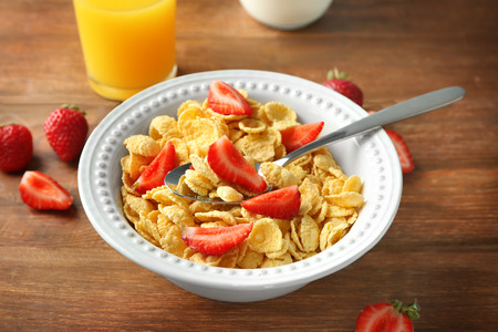 Dish with cornflakes on tableの写真素材