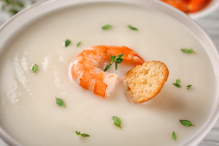 Tasty cream soup with shrimp in bowl, close upの写真素材
