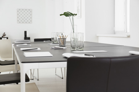Modern office interior with large table and chairs