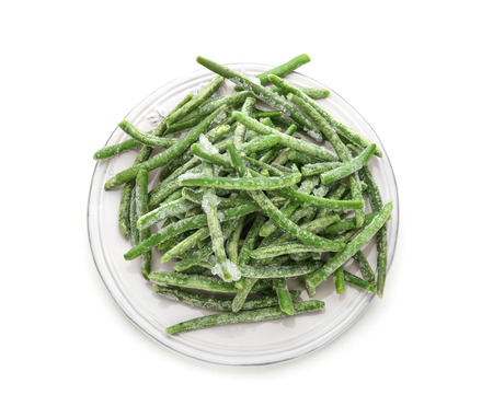 Plate with frozen green beans on white backgroundの写真素材
