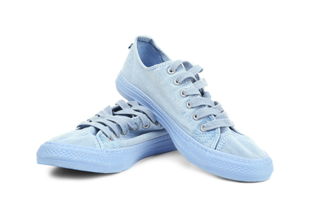 Pair of blue tennis shoes, isolated on whiteの写真素材