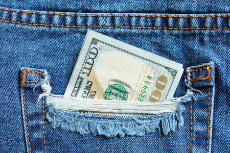 Hundred dollar bill in pocket, closeup